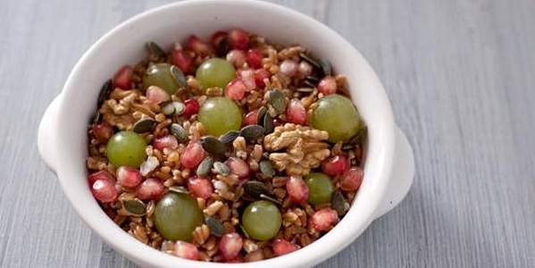 Autumn spelled salad with pomegranate grains and pumpkin seeds