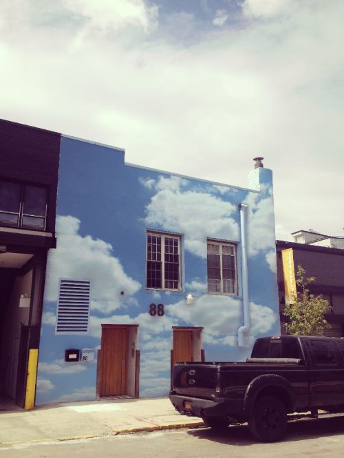 Street art: the sky takes the place of the gray of the buildings