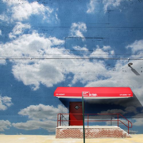 Arte de rua: o céu toma o lugar do cinza dos prédios