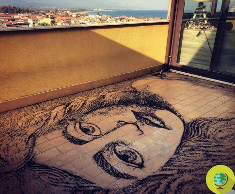 Make an amazing artistic portrait on his balcony with the volcanic ash of Etna